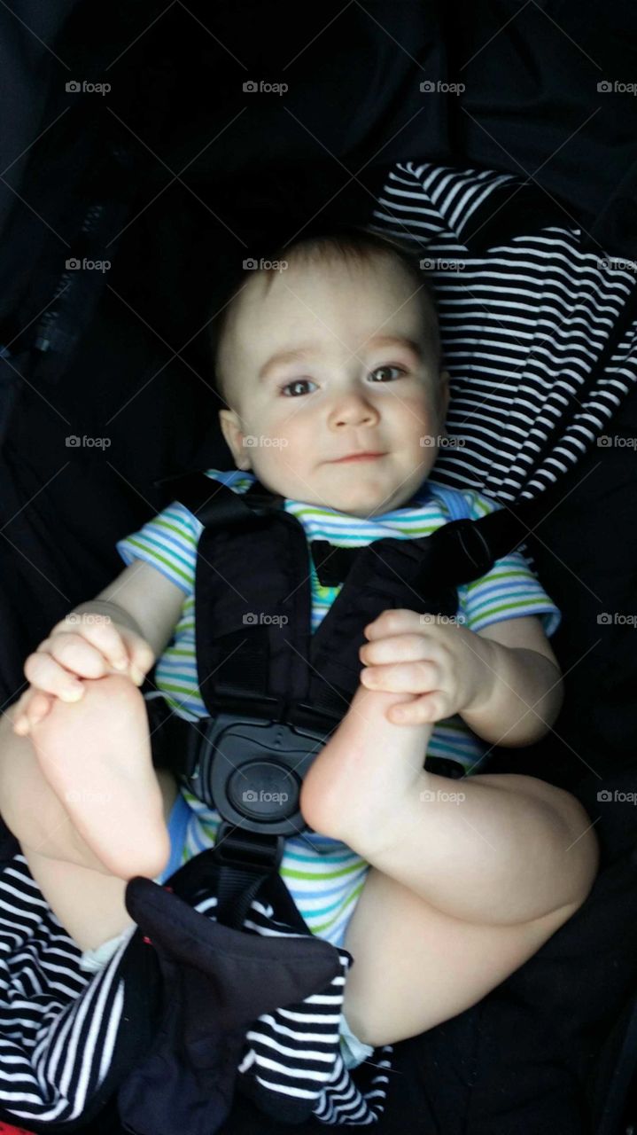 Baby grabbing is feet!