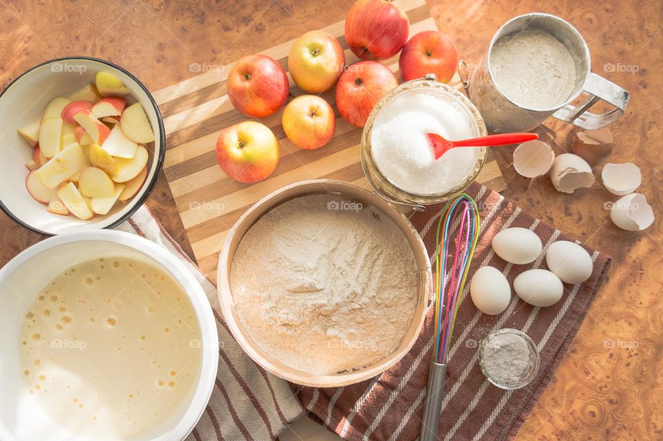 Making homemade puffed apple pie with eggs, sugar and flour.