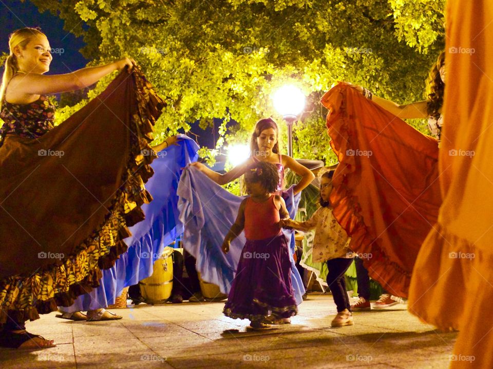 Ladies leading in Dance. Little girls are welcomed into a dance troupe.  