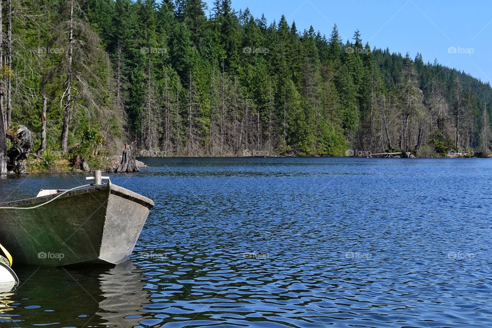 Moored forestry boat on lake. Moored forestry boat on lake