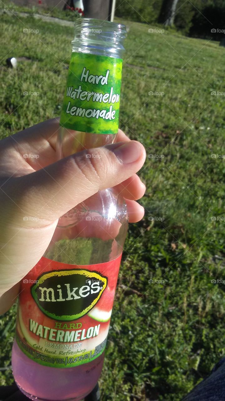enjoying a mike's hard watermelon lemonade