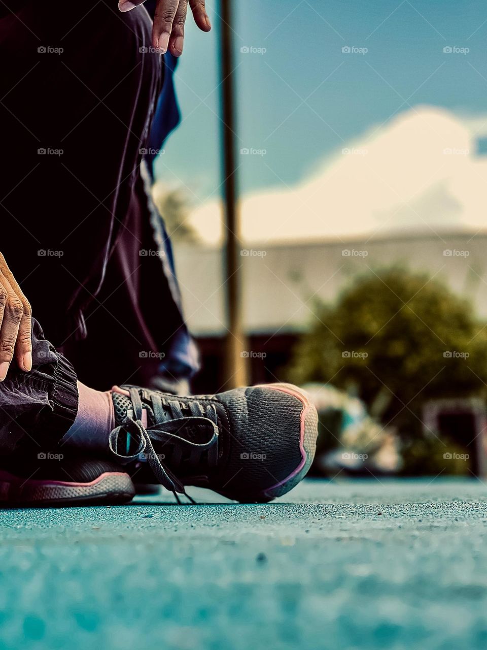 Running shoes on a pavement in close up view. Exercising activities 