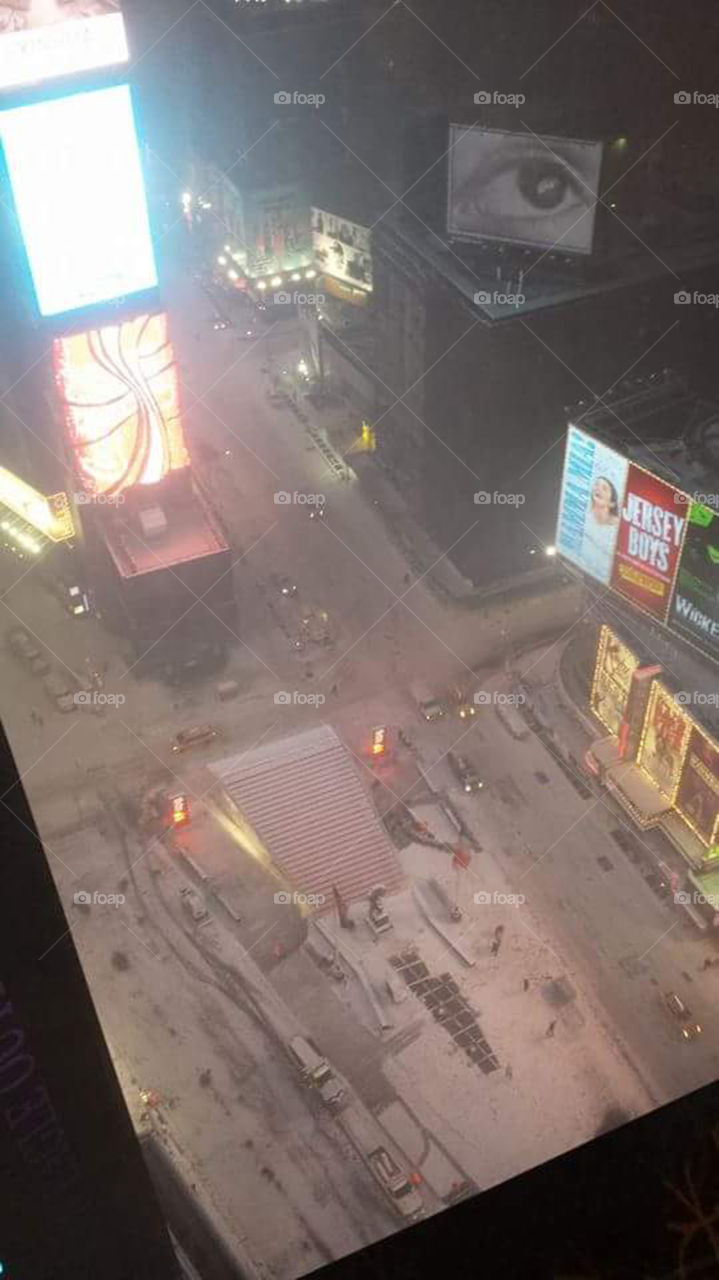 snow covered Times Square. highrise view of New York City's famed Times Square covered in snow