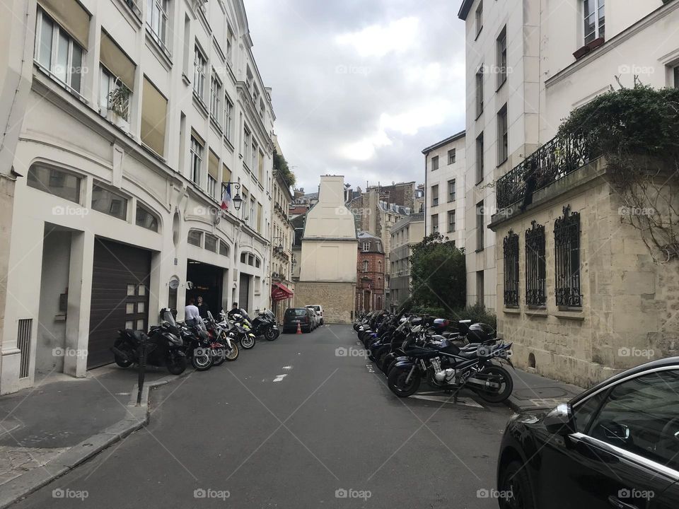 Motorcycles lining the streets of Paris. 