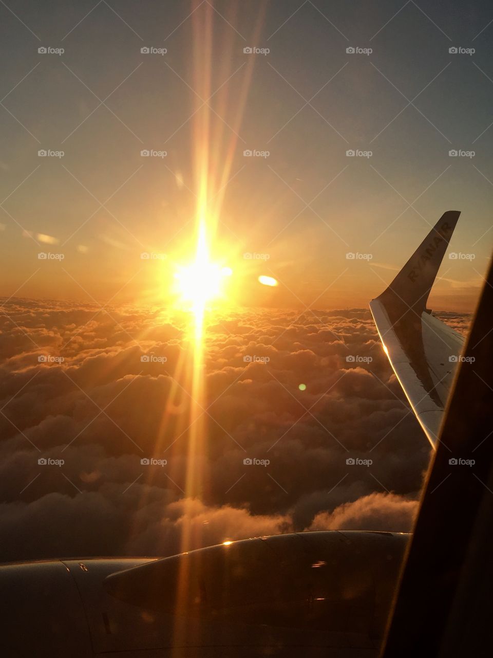 The view of a sunset from an airplane 