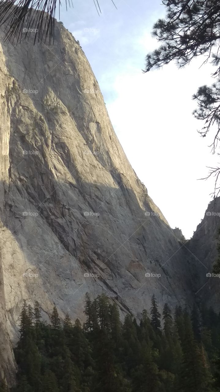 last rays of sun against granite mountain in Yosemite valley
