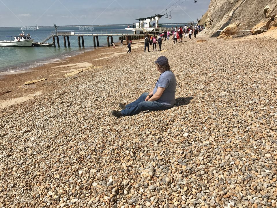 My Dad relaxing on Alum Bay beach. 