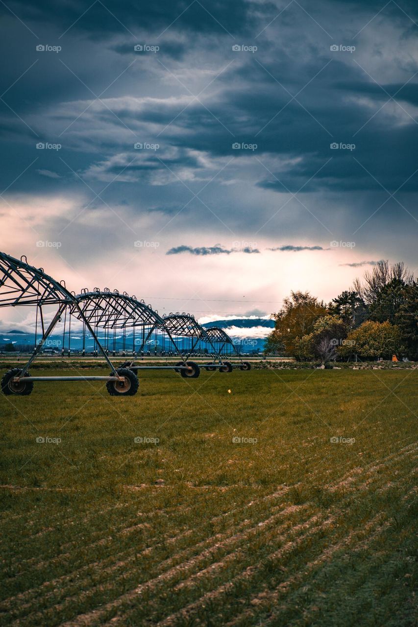 Sprinkler chain and the Rocky Mountain sky.