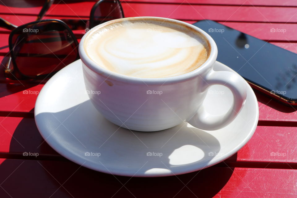 Cappuccino on red table