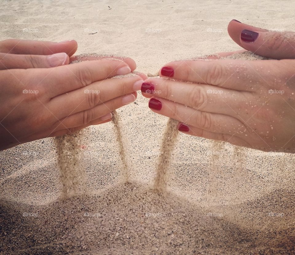 Sand through the palms