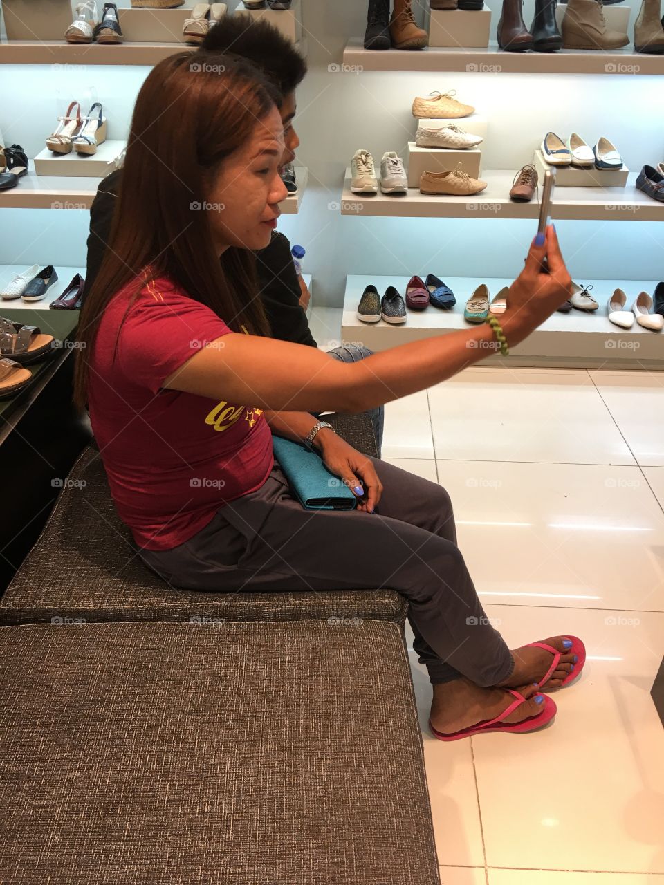 Using phone at the mall