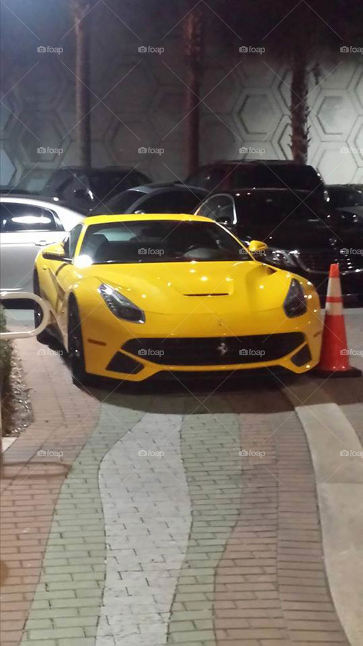 Yellow  Ferrari. Hot yellow Ferrari in valet parking