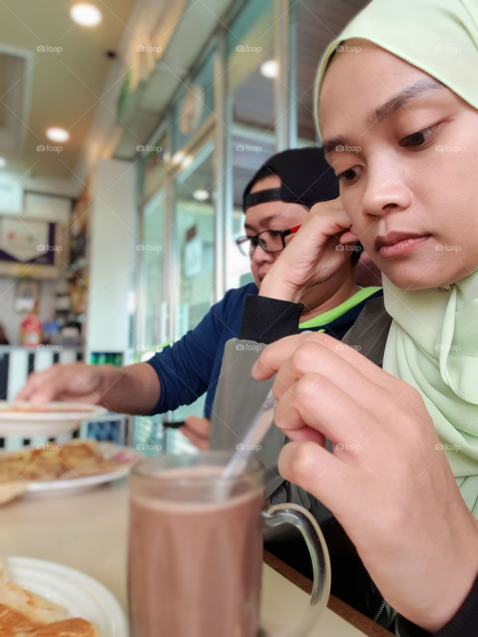 Me having hot drink milo for breakfast with my tomboy sister