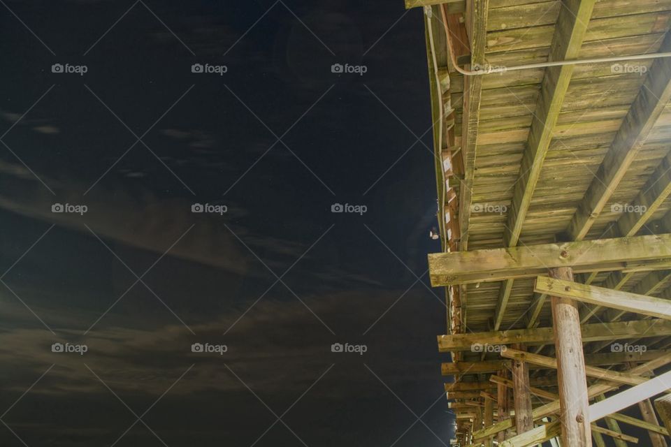 Night sky under the pier