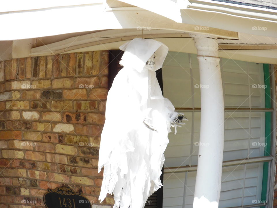 candy 🍬 anyone. This is a picture of a ghost 👻 hanging on the ceiling. 👣 👣 🚶 🏃 🔥 💨