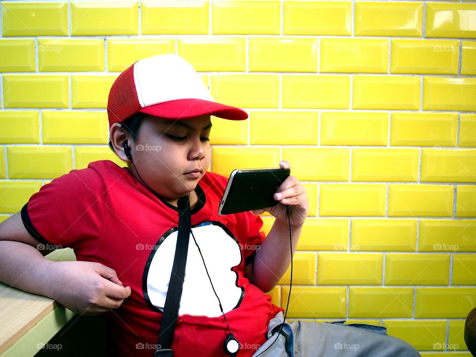 Filipino boy using a smart phone