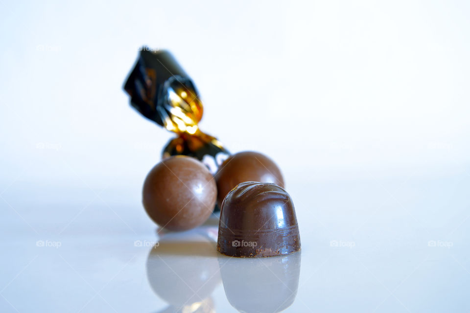 Chocolates against white background