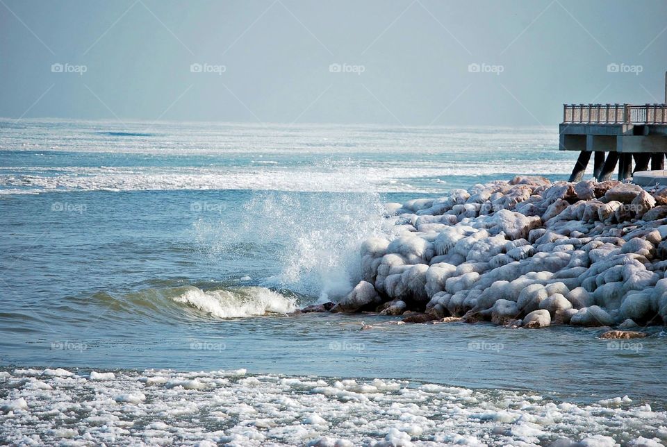 Splashing water on icy rocks