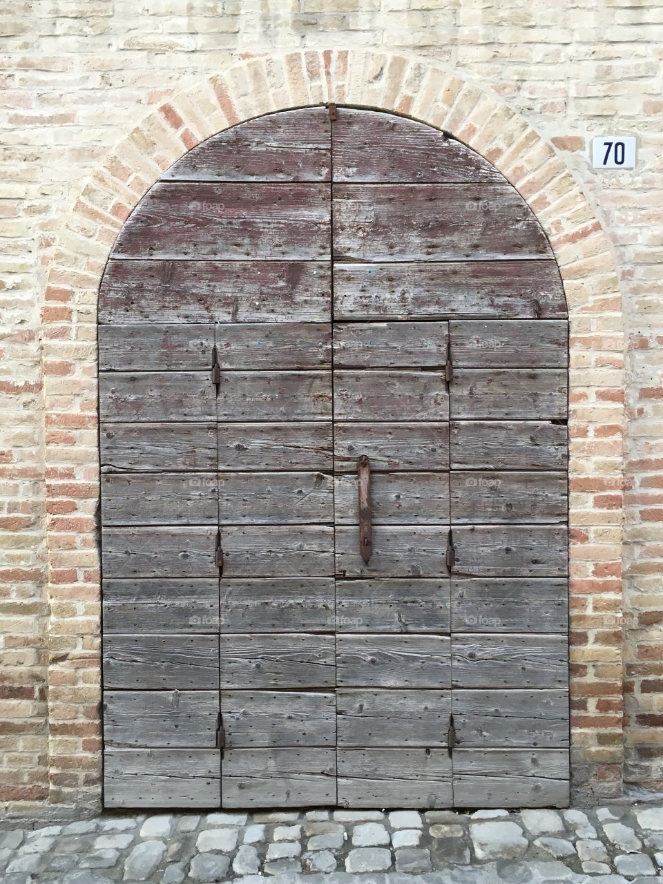 Warehouse old wooden door, Offida, marche region, Italy