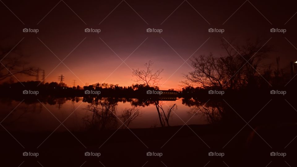 Evening calming setting up for night. Deep colours are fading in to the evening. Extremely peaceful lake, setting for a beautiful night.
