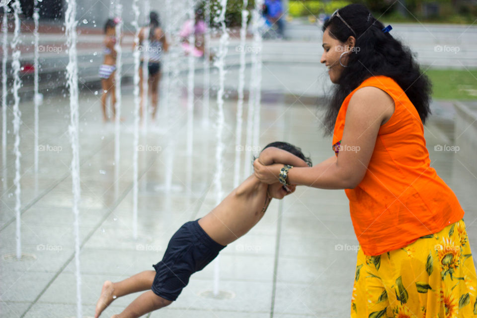Savannah Mom and Son . Clicked this joyous pick of a mom playing with her shy and not willing to get wet son 