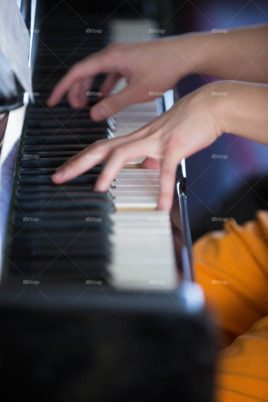 A woman playing a piano