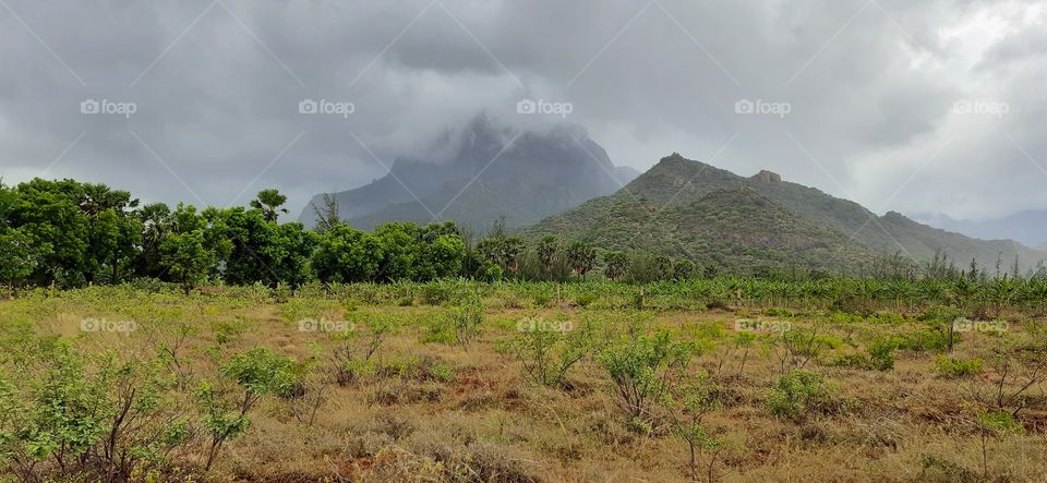 Cloudy rainy...Dark raining cloud over mountain...Freezing view