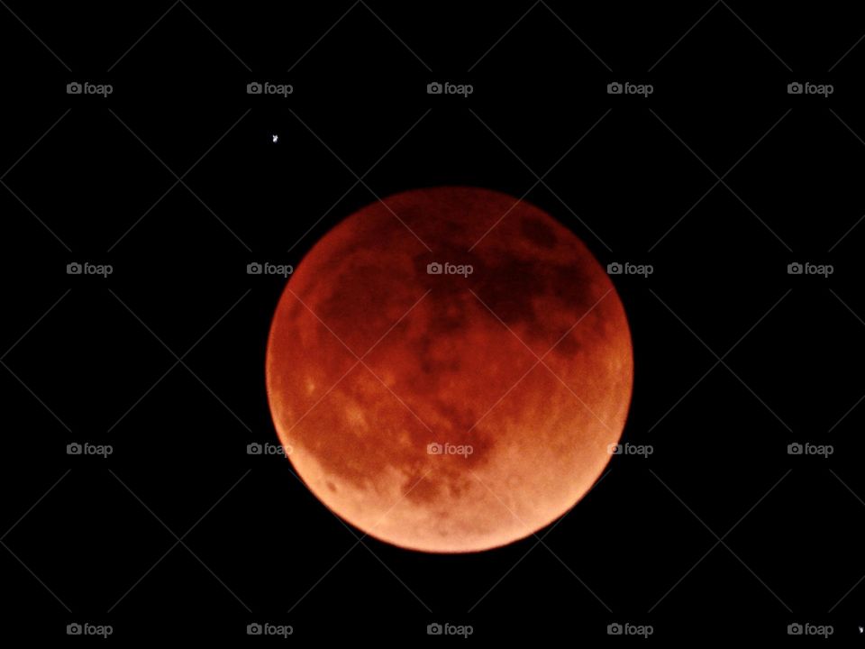 My photos of the Blood Moon, Total lunar eclipse on 15 May 2022 - Lunar eclipses occur when Earth aligns between the sun and the moon and casts a shadow across the lunar surface. The weather condition were very cloudy