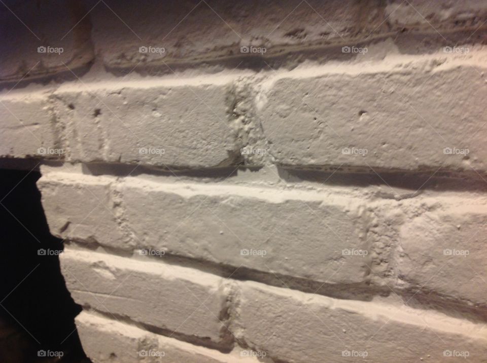 An up close photo of a white brick wall.