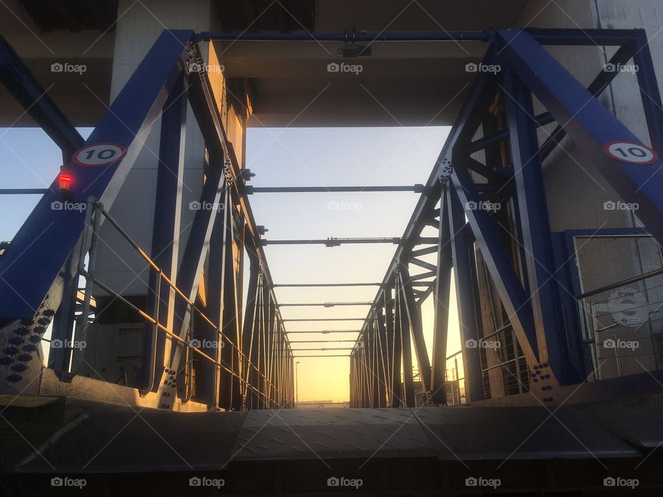 Northern ramp to the Woolwich Ferry at sunset on a Saturday in Spring. Captured from the last southbound ferry of the day, about to cross the River Thames.