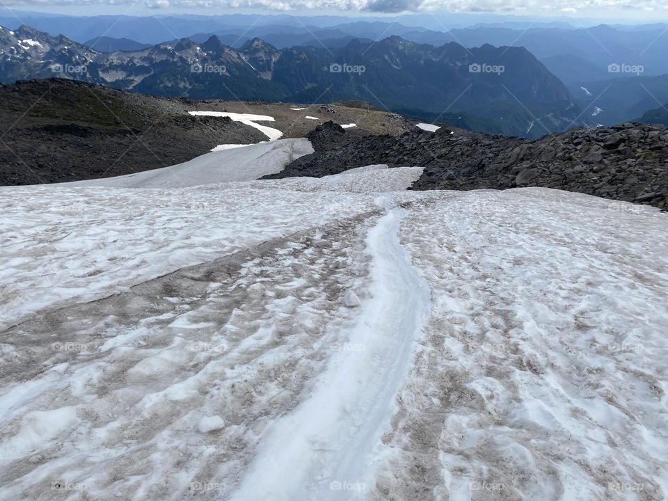 Ice slides from heavenly altitude, Mount Rainier, USA