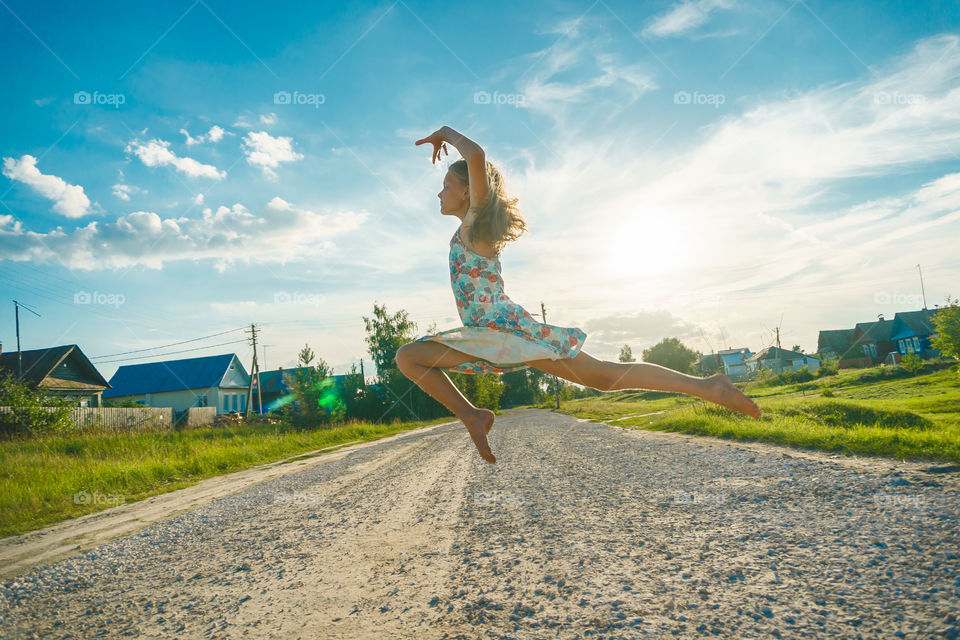 Summer vibes. Girl is dancing and jumping