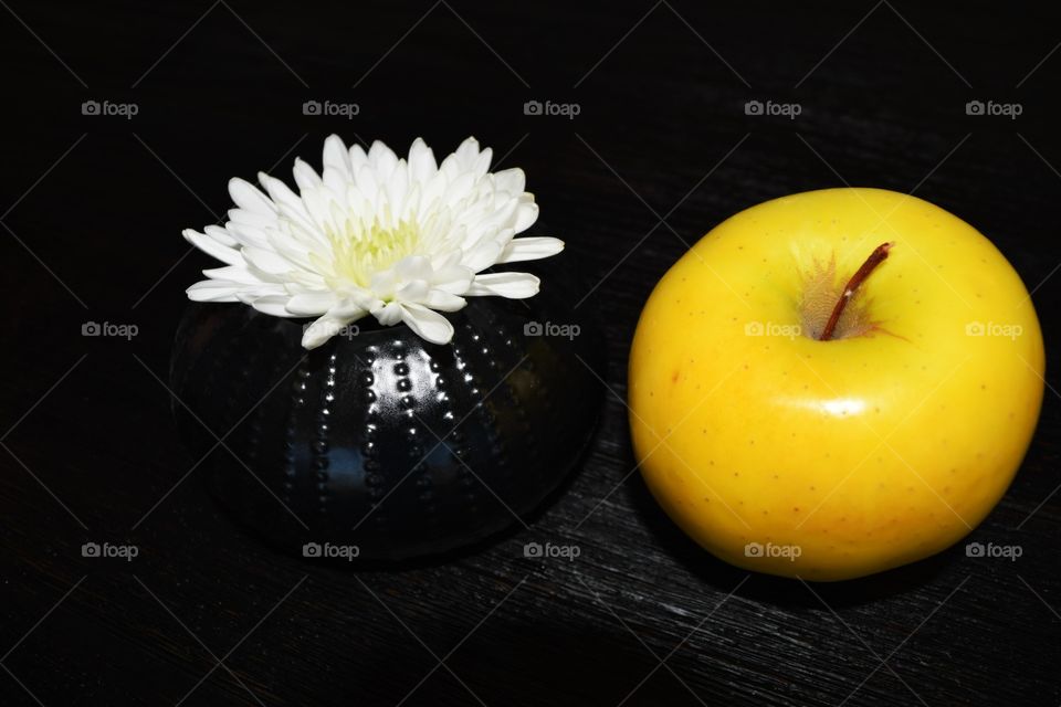 Yellow apple with white flower