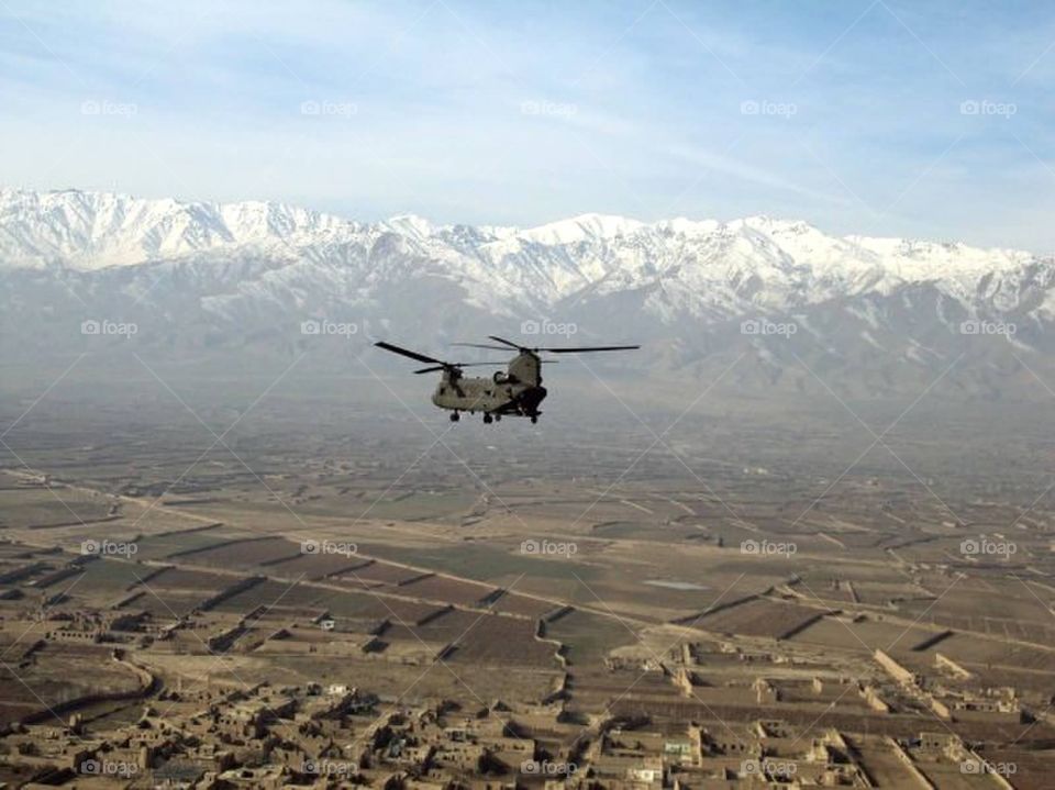 Flight over Afghanistan. Chinook flying over Bagram, Parwan Province, Afghanistan. Breathtaking mountains in the background. 