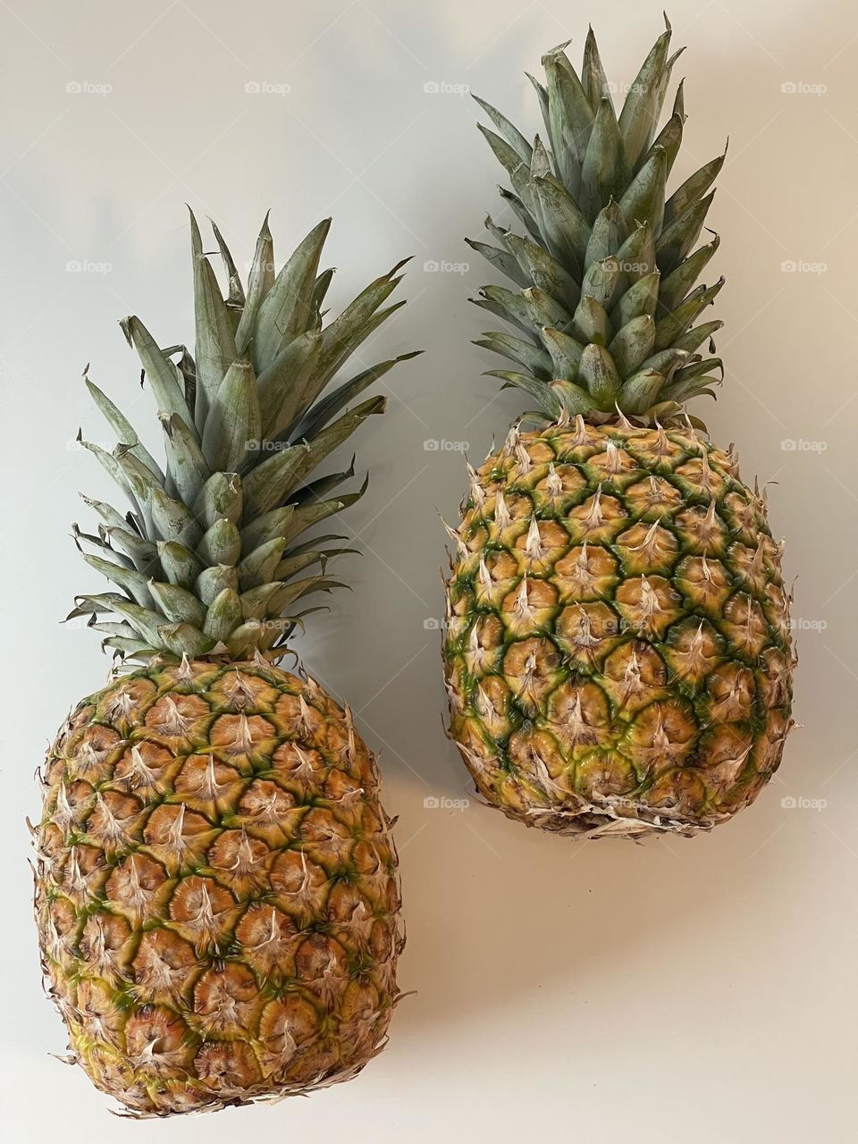 Pineapple seen from above against clear background, tropical fruit, vitamin fruit, healthy eating 