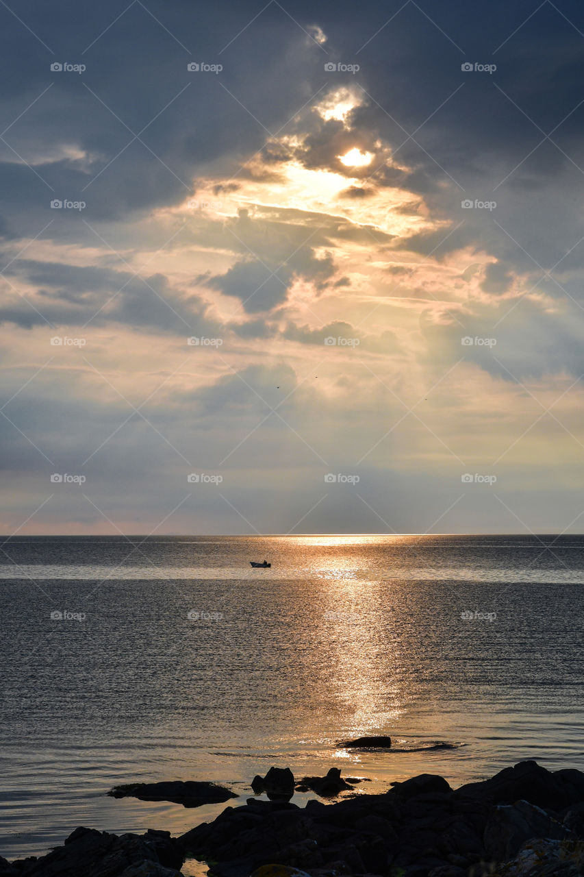 Photo of sunset over ocean or sea