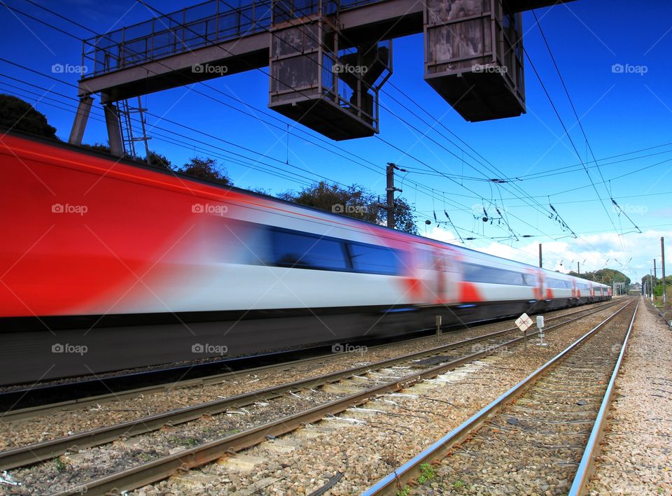 Express Train. A passenger express train speeds past in a blur.