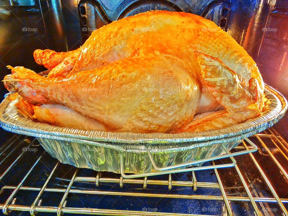Whole Turkey Roasting In The Oven
