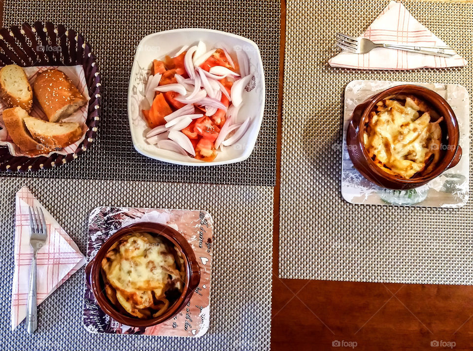 flat lays - moussaka dishes and greek salad