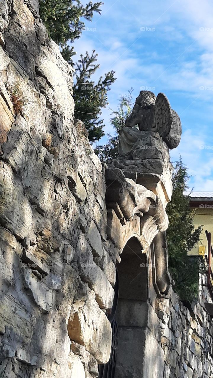 Stone sculpture of an angel stone angel and sky