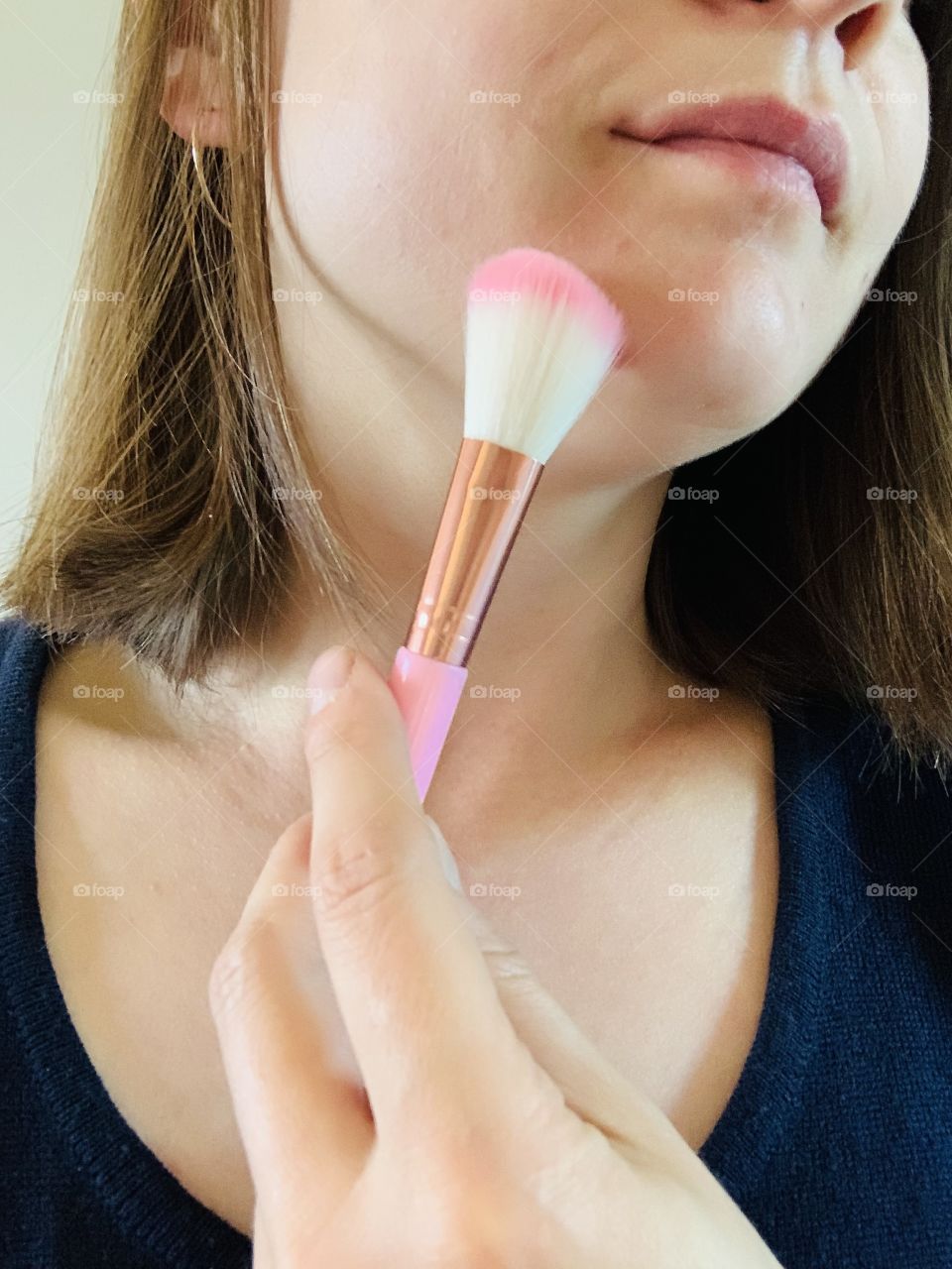 Woman with make up brush 