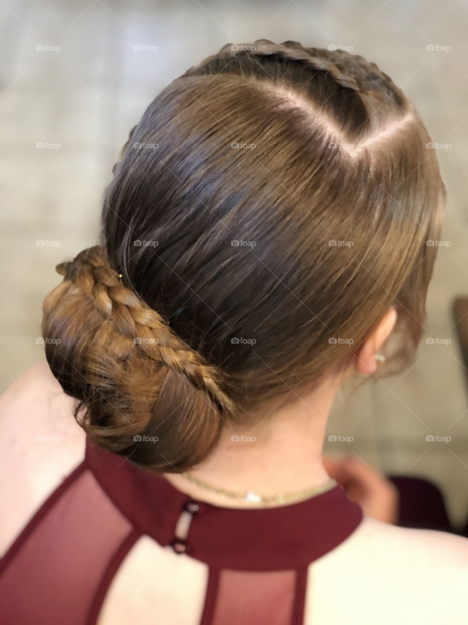 Brunette with braided hair ready for prom or special event 