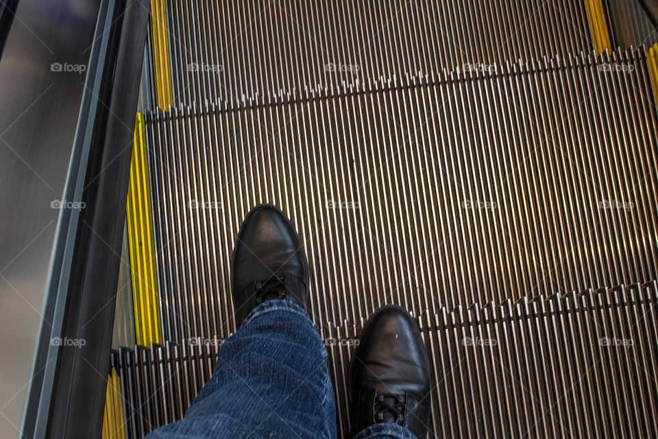 My feet on the escalator 