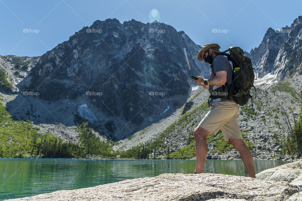 Man hiking with face mask.