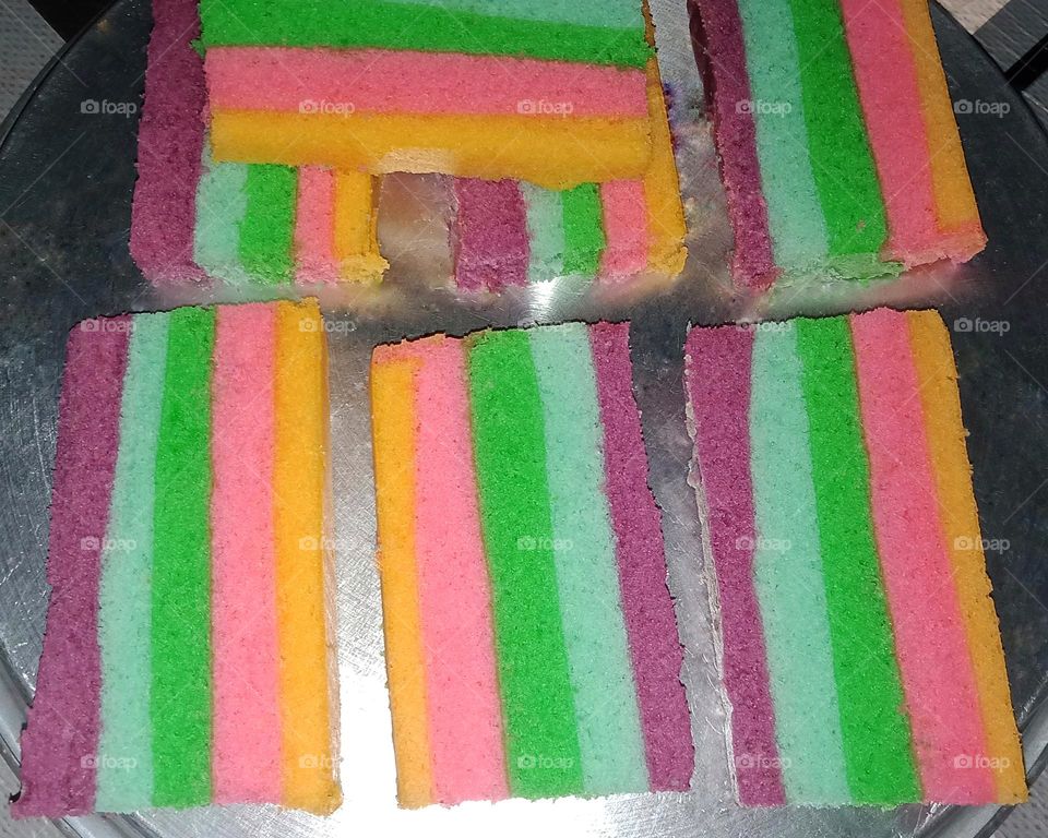 Delicious rainbow cake on pan