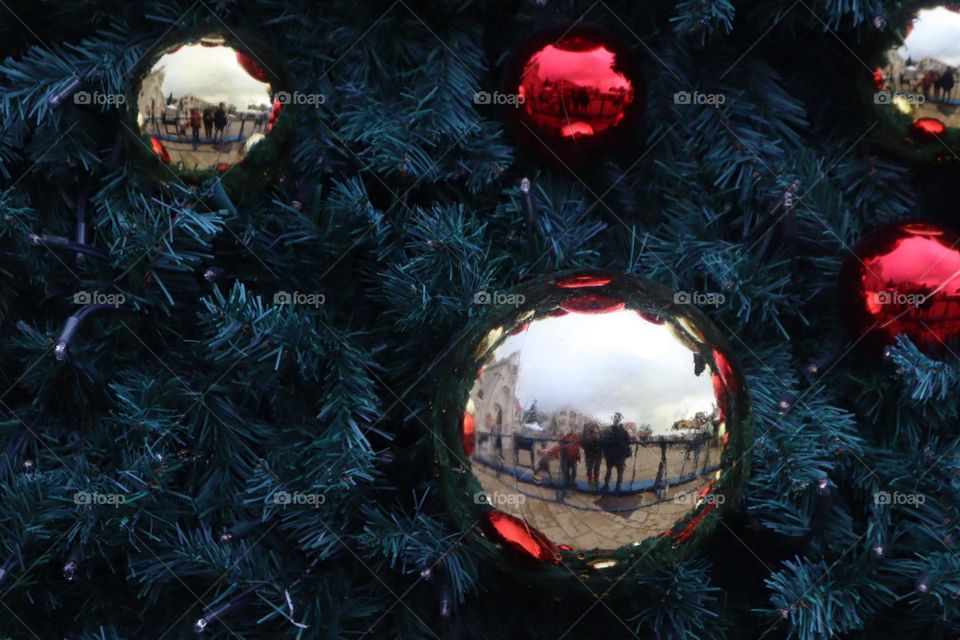 Reflection on Christmas decoration ball on Christmas tree