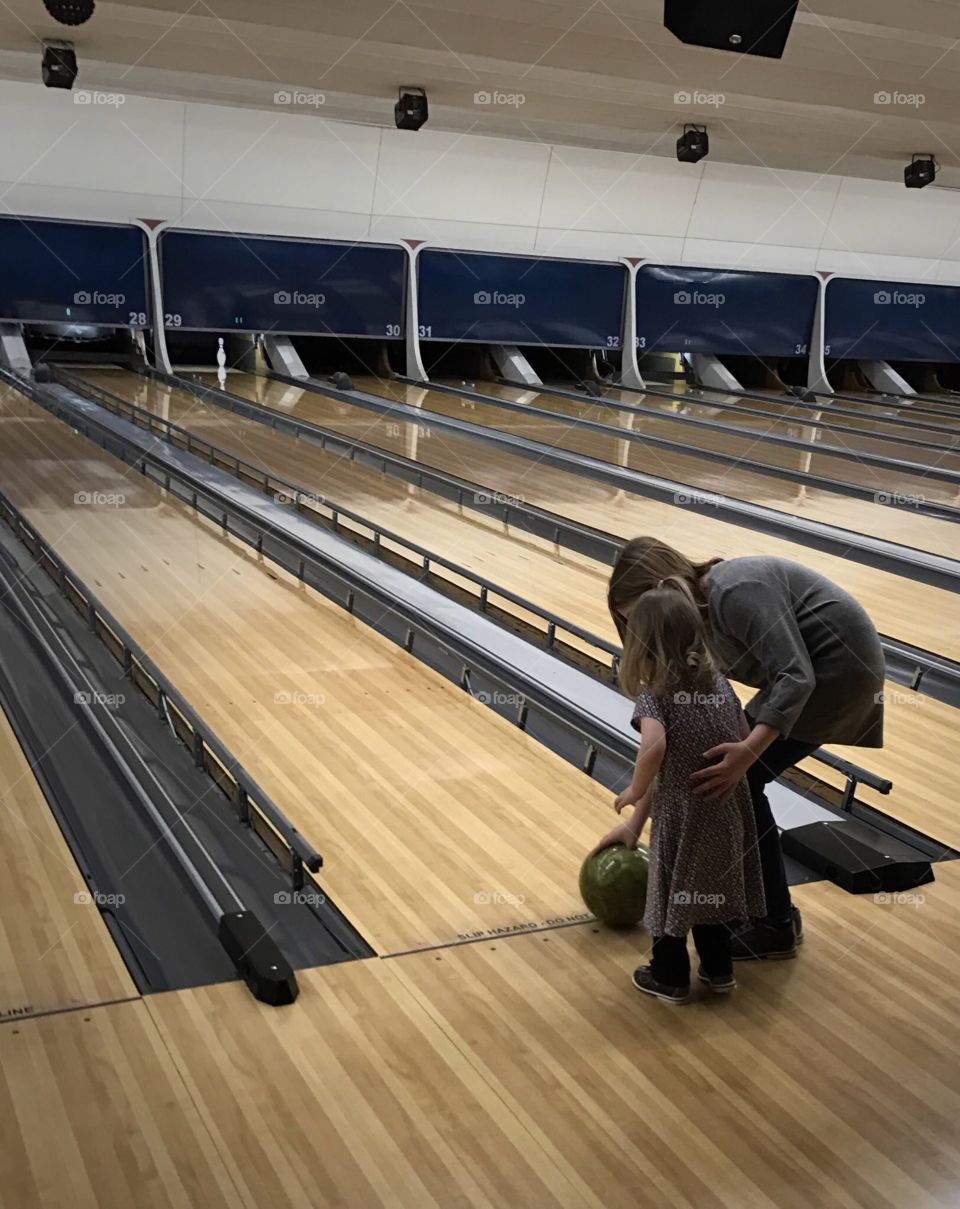 Girls learning bowling