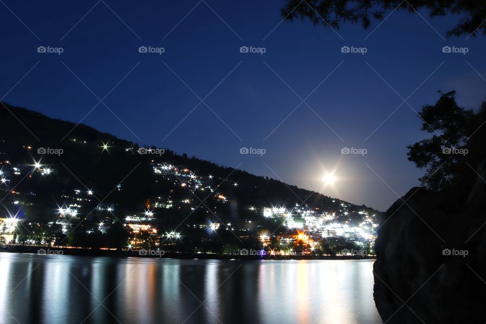 The beautiful hills, majestic lake and the breathtaking moon with reflections