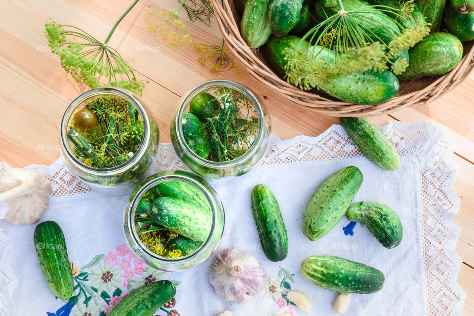 Pickling cucumbers. Pickling cucumbers with home garden vegetables and herbs