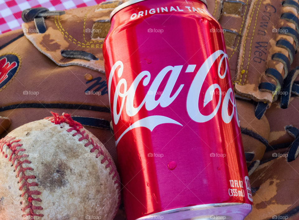 Coca-Cola can with baseball and glove.